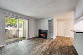 Living Room With Wood-Style Flooring & Glass Patio Door